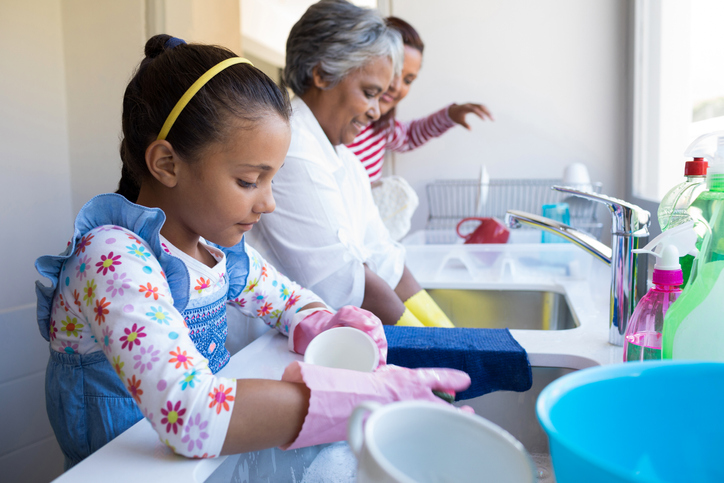 family cleans dishes